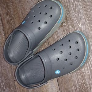 Crocs grey shoes with blue accents. Size 10. Worn a few times